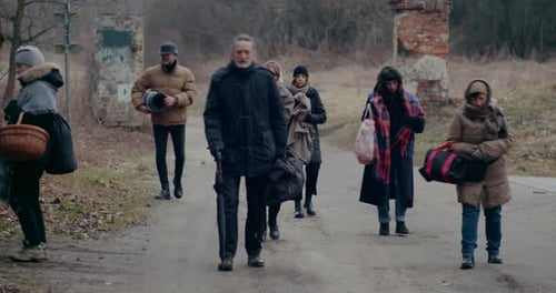 Group Walking Down a Road on Overcast Day