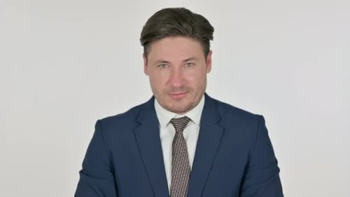 Man in Business Suit Looking at Camera