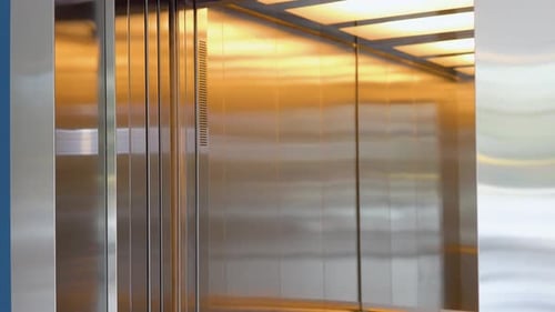 Elevator Doors Opening and Closing in a Modern Building