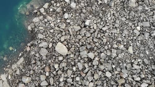 Blue Water And Rocks. Aerial View.