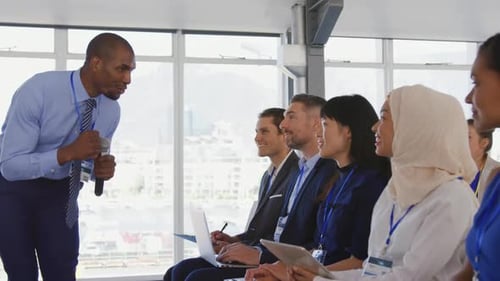 Motivational Speaker Presents to Diverse Audience