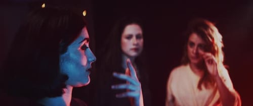 Women Gathering at Night With Vintage Camera