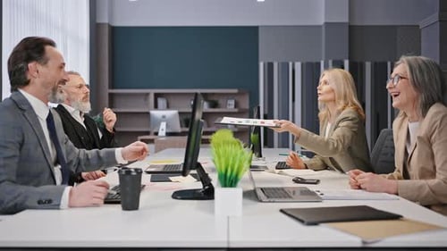 Business Team Discusses Project in Modern Office