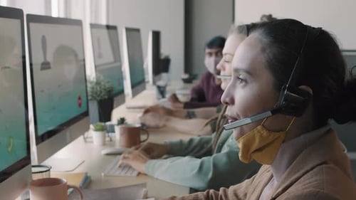 Call Center Agents Making Sales in Office