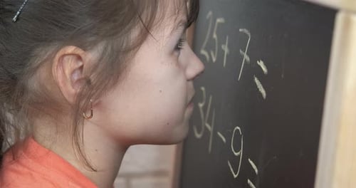 Math exercises on blackboard.