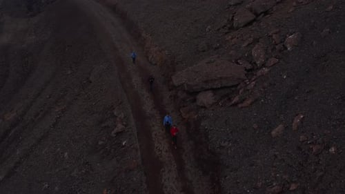 Overhead View Four Backpacker Traveler Walking Pathway Trekking in Iceland