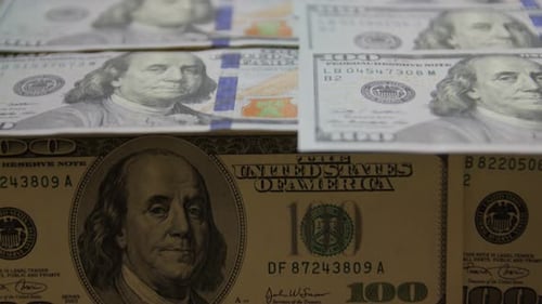 Panning View of Rows of One Hundred Dollar Bills