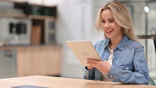 Woman Participates in Video Call on Tablet Device