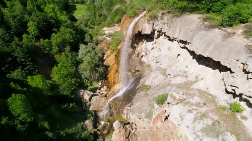 Aerial View of Waterfall Surrounded by Greenery