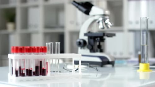 Close Up of Desk with Laboratory Equipment and Glassware on It