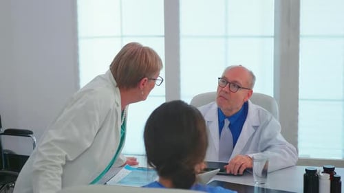 Medical Professionals Discussing Patient Care in a Meeting