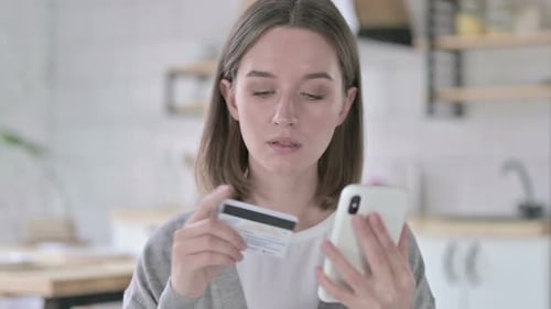 Young Woman Makes Online Purchase on Mobile