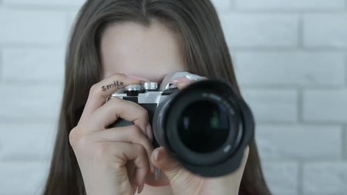 Girl Photographer with a Camera