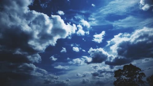 Fluffy Clouds Moving in Blue Sky
