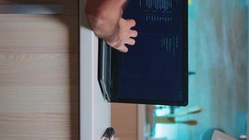 Close up of person coding at home