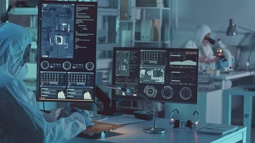Engineer Looking at Motherboard Components on Computer Monitor