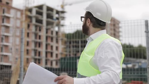 Portrait of a Successful Young Engineer or Architect Wearing a White Helmet