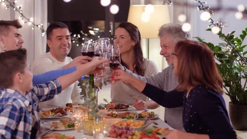 Family Christmas Dinner with Wine Toast at Home
