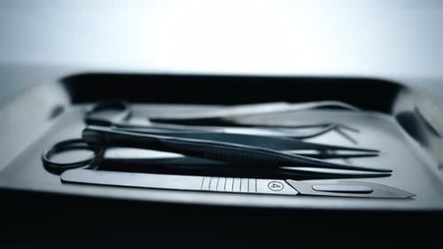 Medical Instruments in Steel Tray on Table for Surgery