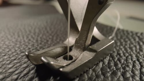 Sewing Machine Stitching Black Leather Close-Up
