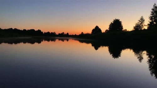 River Surface At Sunset