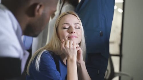 Medical Team Discussing Healthcare in Bright Office