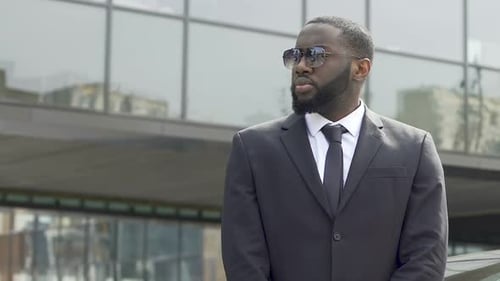 Bodyguard Awaiting Appearance of Governmental Motorcade Inspecting Territory