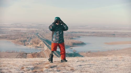 Man with Prosthetic Leg on Snowboard