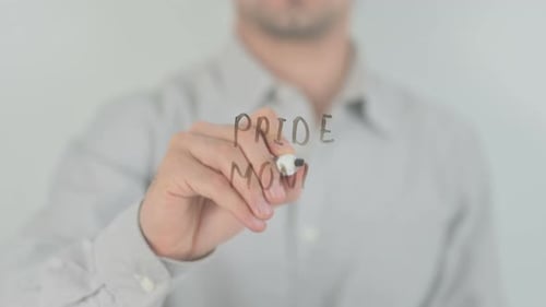 Writing Pride Month on Clear Surface