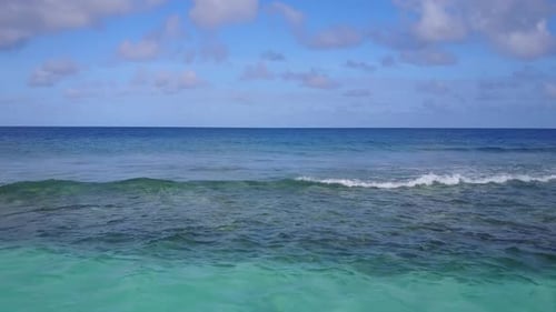 Drone aerial sky of exotic seashore beach by blue sea and sand background