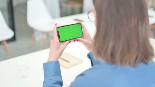 Young Adult with Smartphone with Green Screen