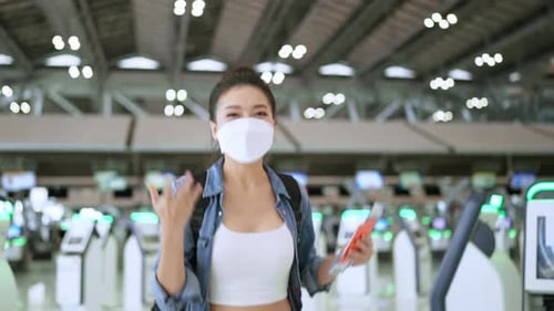 Young Woman Ready for Travel in Airport