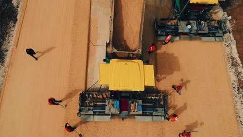 Aerial View of Road Paving with Heavy Machinery