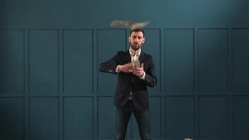 Young Happy Businessman Dancing and Throwing Money. Slow Motion. Successful Business or Winning the