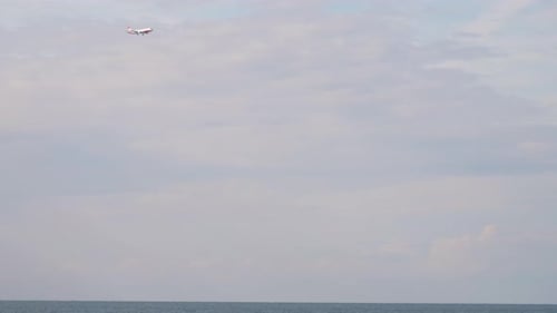 Plane Flies Over the Sea