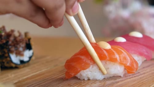 Traditional Japanese Nigiri Sushi with Salmon on Plate