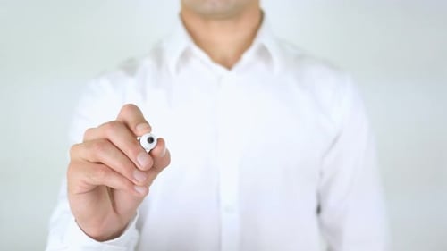 Man Writes Core Value on Transparent Surface