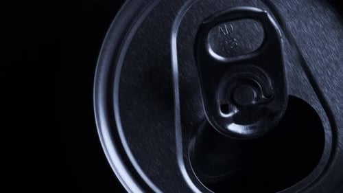 Top View of Aluminum Beverage Can with Beer or Soda. Close-up Rotating Footage