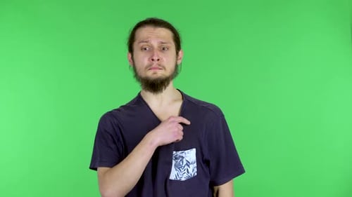 Man Is Hot and Uncomfortable on Green Screen
