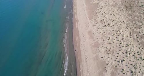 Aerial Tilt Up Shot of a Remote Virgin Sandy Beach on the Adriatic Sea