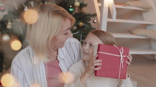 Woman and Child Share Christmas Gift