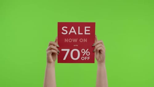 Sale Now On Up To 70 Percent Off Inscription on Paper Sheet in Womans Hands on Chroma Key