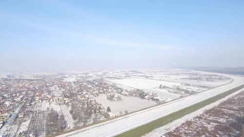 Aerial Shot Of A Village Landscape In Winter