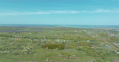 Copter Flies Over the Countryside the Houses are in a Row the Roads