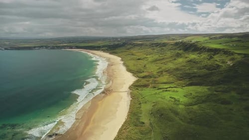 Hyperlapse Irish Coast Aerial View: Sand Beach with Water Waves. Wonderful Atlantic Ocean Seascape