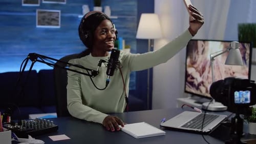 Woman Records Herself with Phone in Studio