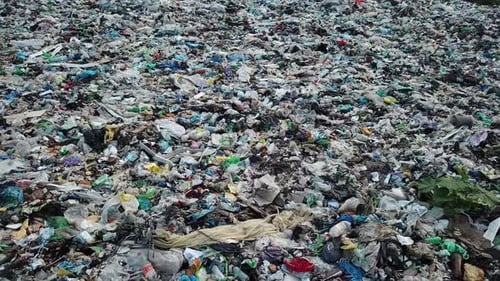 Plastic in the mountains, Mountain garbage, large garbage pile, degraded garbage.