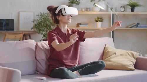 Woman Using Virtual Reality Headset at Home