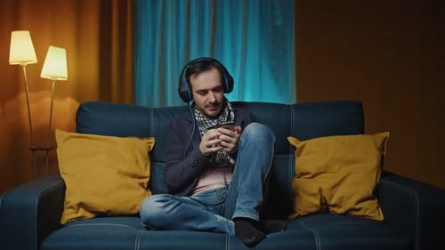 Man Listening to Music and Using Cell Phone