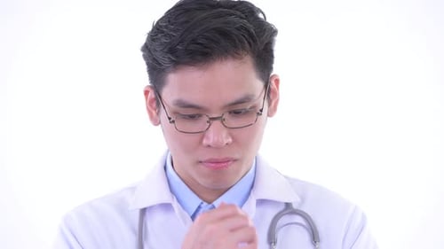 Young Adult Doctor Deep in Thought, Close Up
